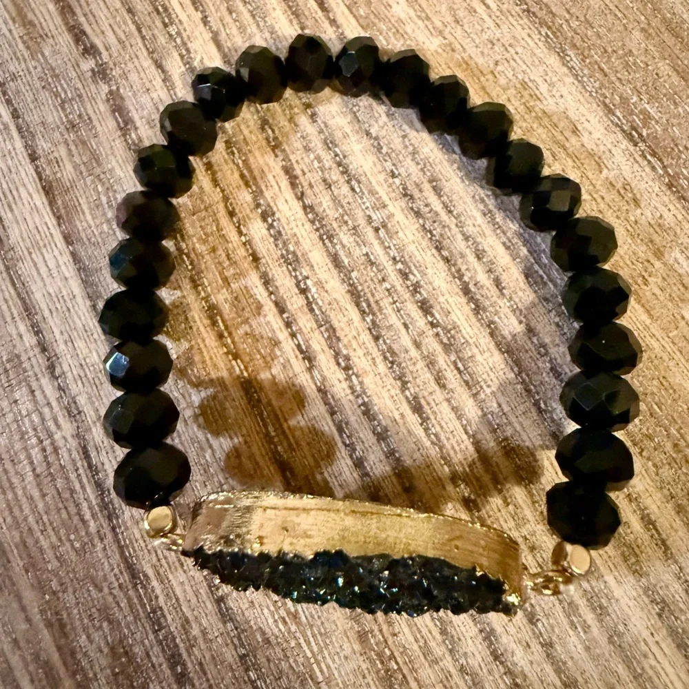 Unique Black Beaded Bracelet with Gold Accents